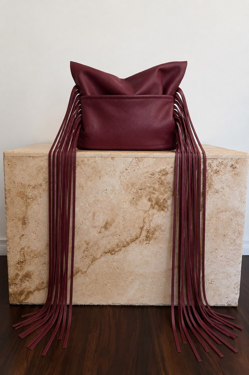 Fringed leather handbag